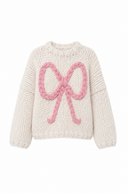 Klarza chunky knit merino wool sweater with pink bow detail in cream